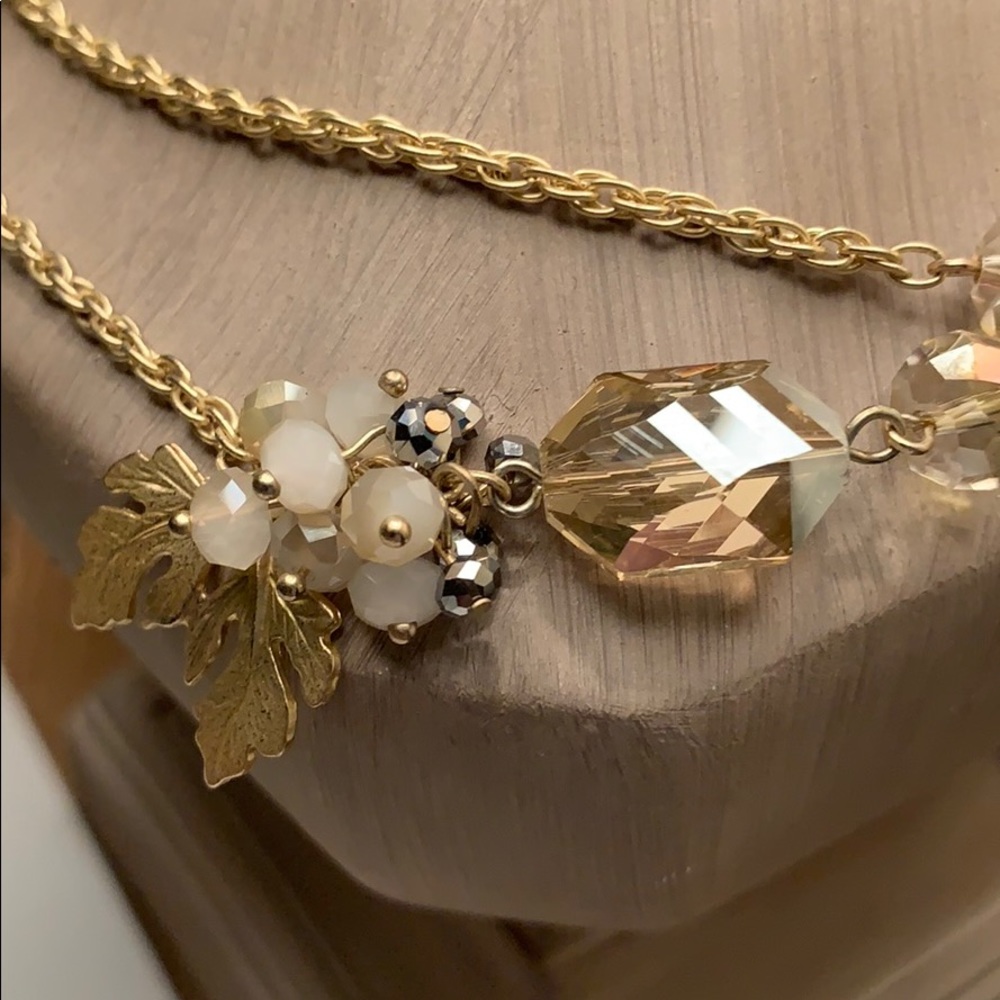 Long gold necklace.